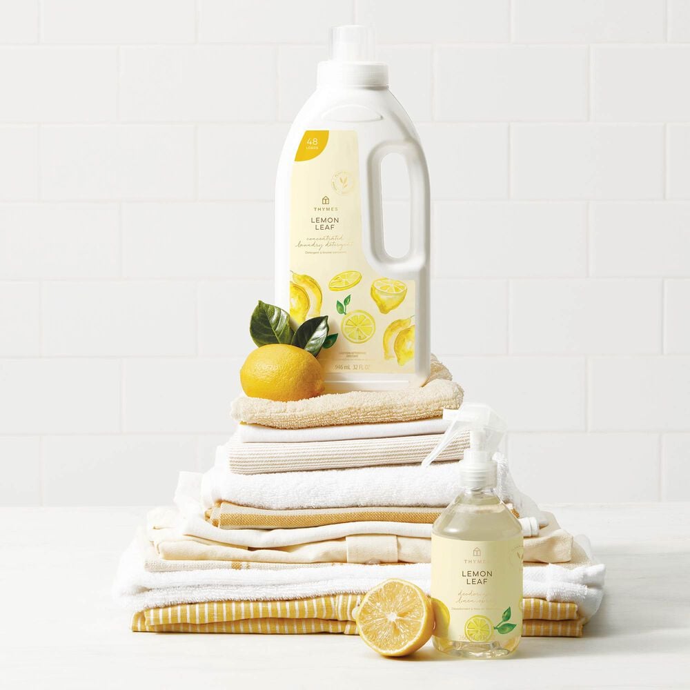 Thymes Lemon Leaf Linen Spray to Freshen Fabric and Closets with Thymes Lemon Leaf Concentrated Laundry Detergent on top of towels image number 2